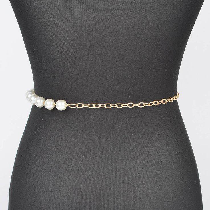 A sophisticated blend of elegance and style, the Multi Layered Pearl Gold Chain Belt is a statement accessory for any fashion-forward wardrobe. This exquisite piece features multiple layers of lustrous pearls intertwined with gleaming gold chains, creating a stunning contrast that catches the eye. Whether you're dressing up for a special occasion or adding a touch of glamour to your everyday outfit, this belt is sure to make a lasting impression. - 0.65" Wide x 47" Long - Imported Pearl Gold Chain, Gold Chain Belt, Scarf Gift, Chain Belt, Everyday Outfit, Pearl Chain, Multi Layering, Long Tops, Short Tops