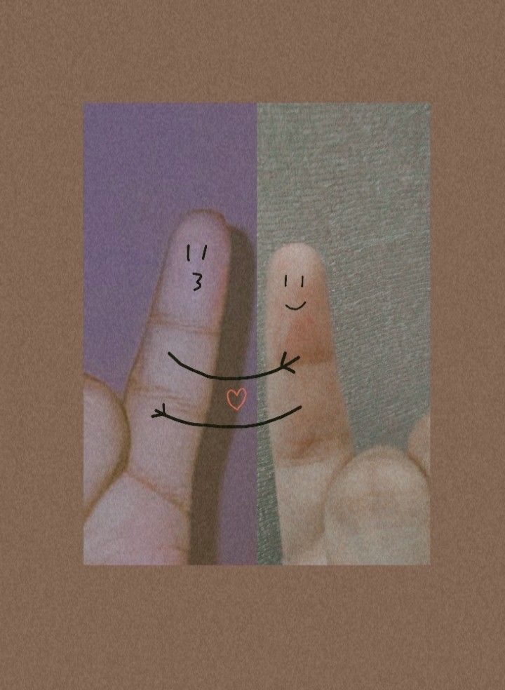 two fingers with faces drawn on them, one is holding the other's hand