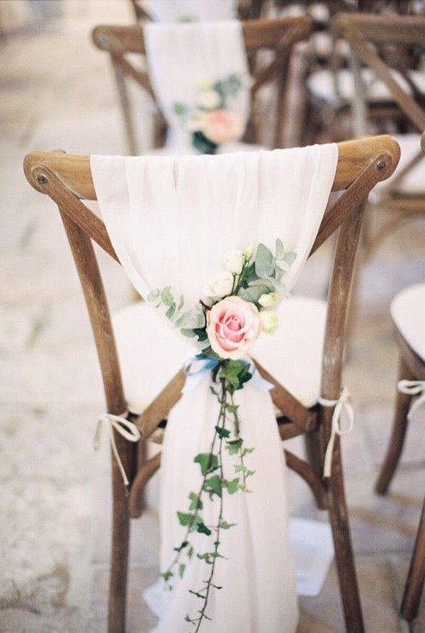 a chair decorated with flowers and greenery for a wedding or special event is shown