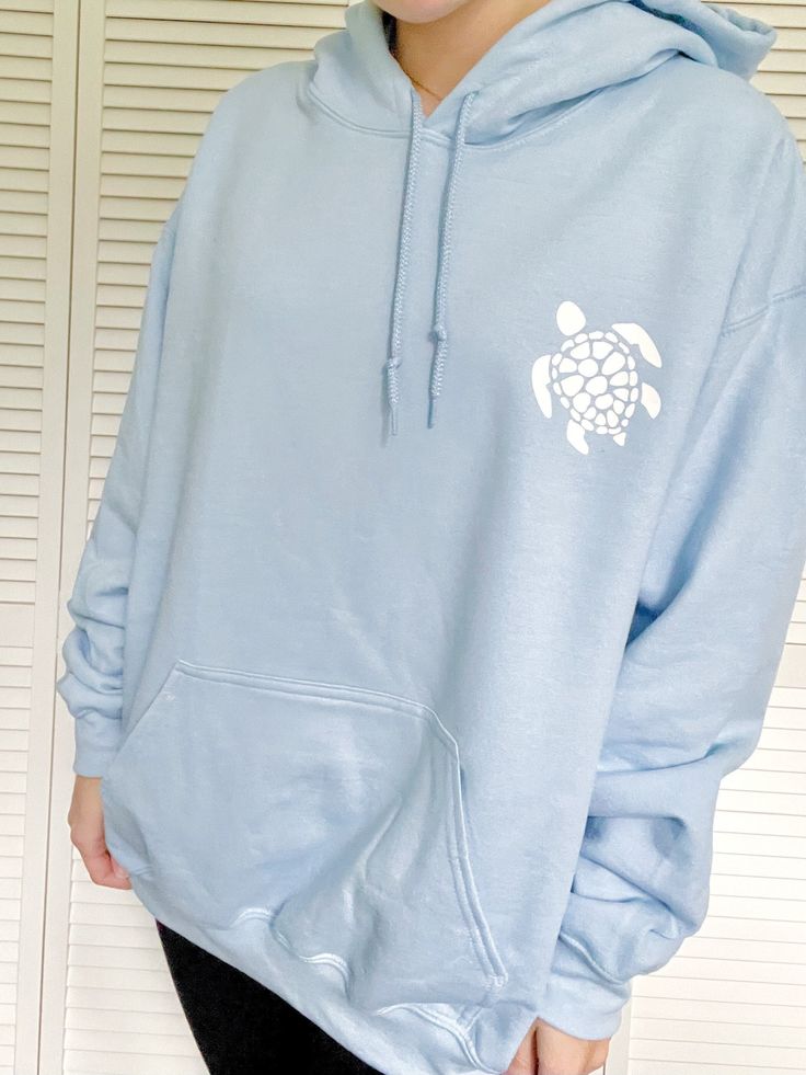 "Light blue colored hoodie with a white sea turtle. This hoodie is so cute and cozy. ✰ MODEL INFO: ✰ Height: 5'4\" Size: normally wears a small, but is modeling a large for an oversized look. ★ MATERIAL: ★ 50% cotton, 50% polyester" Surfer Life, Tee Turtle, Sea Turtle Shirt, Sweat Vintage, Save The Turtles, Dolphin Gifts, Turtle Shirts, The Turtles, Turtle Gifts