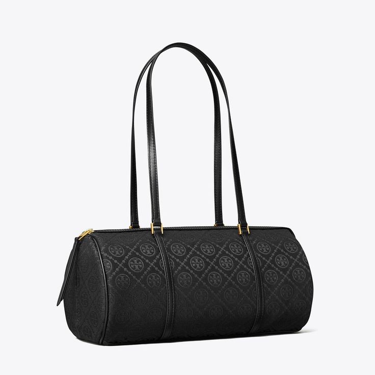 Our signature pattern in woven jacquard. The collection speaks to the timelessness of great style. The T Monogram Barrel Bag — luxury meets utility in a classic silhouette. Perfect proportions in a distinctive shape that dates back to 16th-century mariners. The modern leather frame and stitch-wrapped top handles with buckle details reinforce the craftsmanship, preserving its structure and shape. Timeless Monogram Canvas Bag For Formal Occasions, Elegant Monogram Canvas Bags For Formal Occasions, Timeless Monogram Canvas Shoulder Bag For Formal Occasions, Elegant Monogram Canvas Shoulder Bag For Formal Occasions, Elegant Monogram Canvas Shoulder Bag For Formal Events, Elegant Formal Monogram Canvas Shoulder Bag, T Monogram, Leather Frame, Utility Bag