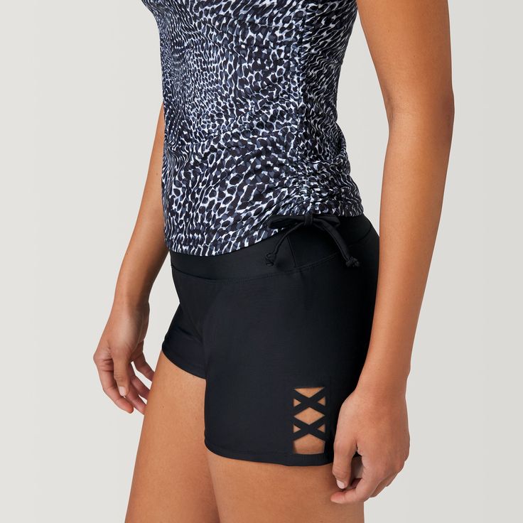 This fashionable tankini top is designed for the water, but transitions to post-swimming activities seamlessly. It’s what’s on the inside that counts here: a shelf bra with set-in molded cups provides shape and support without any harsh underwire Packed with performance details—like UPF 50+ protection, four-way stretch and quick-drying technology—it’s perfect for action-filled days in the sun. To build a better basic, we added a stylish cut-out detail on the back, plus full side shirring with ad Sporty Tankini With Built-in Bra For Pool, Stretch Tankini With Built-in Bra For Swimming, Black Tankini With Built-in Cups For Swimming, Beachwear Tankini With Built-in Cups For Swimming, Beachwear Tankini For Workout During Beach Season, Black Tankini With Built-in Shorts, Stretch Tankini With Built-in Shorts For Beach, Sporty Beach Tankini With Built-in Bra, Beach Tops With Built-in Bra