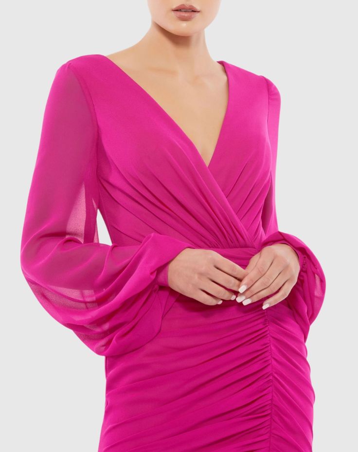 Ieena for Mac Duggal  Chiffon and jersey fabric (100% polyester) Fully lined through body; sheer unlined sleeves Faux wrap v-neckline  Long blouson sleeves  Ruching down front and back of skirt  Concealed back zipper Approx. 33" from top of shoulder to bottom hem Available in Hot Pink Style #A26655 Hot Pink Party Dresses, Classic Cocktail Dress, Plastic Dress, Chiffon Cocktail Dress, Pink Party Dresses, Mac Duggal Dresses, Chiffon Mini Dress, Chiffon Fashion, Fitted Mini Dress