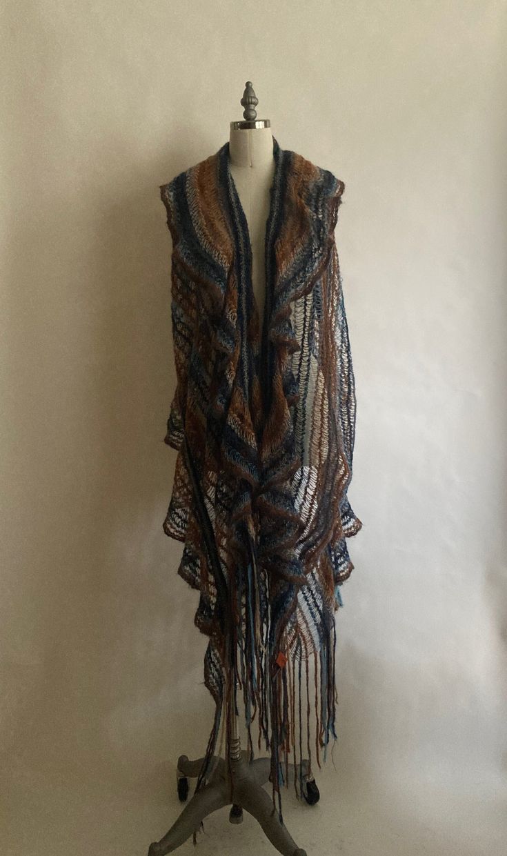 "Gorgeous loose knit Missoni s with two ruffled edges and long fringe. In excellent vintage condition. Length 72\"(not including fringe) Width 30\" Fringe- longest is 12\" 38% Acrylic 27% Mohair 25% Polymide 10% Elastane" Bohemian Shawl For Fall Layering, One Size Brown Shawl For Festival, Bohemian Knit Shawl For Fall, Bohemian Fall Scarves With Tassels, Bohemian Knit Scarves For Fall, One Size Bohemian Scarves With Fringe, Bohemian Fringe Scarves One Size, Bohemian Knitted Shawl Scarf, Bohemian Handwoven Shawl One Size