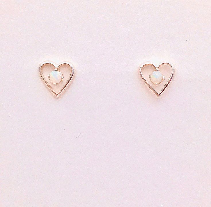 Genuine opals are small and measure 2.5mm and we're handset in sterling silver heart shaped mountings. Comes in a gift box Black Sapphire Earrings, White Stone Earrings, Sapphire Studs, Earrings Heart, Birthstone Earrings, Tourmaline Jewelry, Stone Studs, Birthstone Earring, Childrens Jewelry