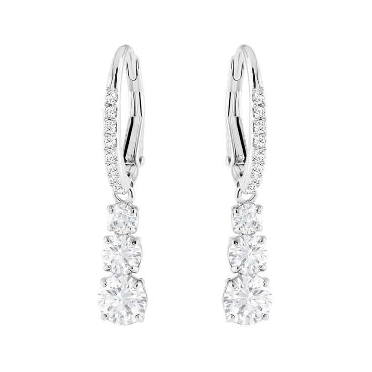 Conceived with the romantic concept that eternal love must have a past, present and future, these stunning Swarovski earrings feature a trio of crystals embelished with a pave scintillating design. Timeless and elegant, they are a treasured keepsake.- Earrings are rhodium plated for a white bright finish- Earrings measure 1 1/8" long- Swarovski's enduring quest for innovation, beauty and excellence is characteristic of their exquisite designs- Free cleaning and inspection at Day's for life of th Round Pendant Necklace, Crystal Dangle Earrings, White Crystals, Swarovski Earrings, Swarovski Jewelry, Matching Necklaces, Pierced Earrings, Round Earrings, Accessories Jewelry