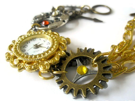 This beautiful steampunk watch bracelet is a unique art piece for the purveyor of eclectic and sophisticated hand-crafted artisan jewelry. Steampunk is a unique style that combines the Victorian look with a cog and steam powered industrial revolution look. The effect is certainly unique and Fantasy Bracelet, Steampunk Bracelet, Steampunk Watch, Watch Jewelry, Swarovski Crystal Jewelry, Crystal Jewellery, Chunky Bracelets, Watch Bracelet, Steampunk Jewelry