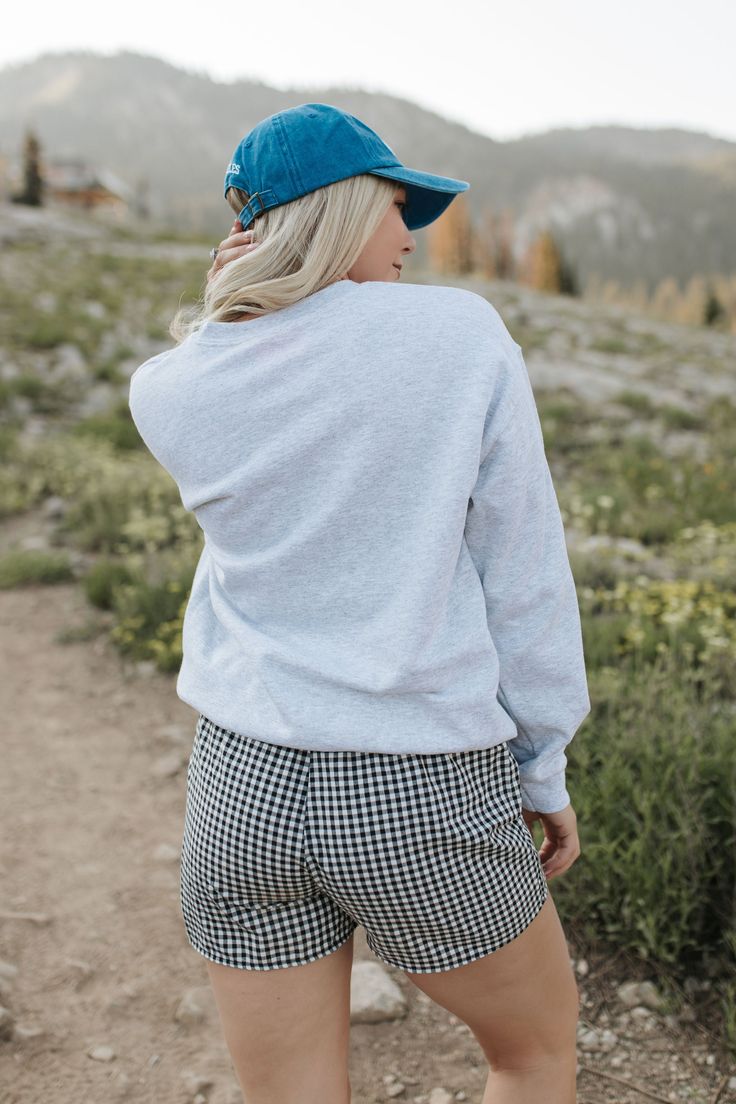 Go for a winning look with THE 98 SWEATSHIRT IN ASH. The oversized fit and grey fabric provide ultimate comfort, while the bold 98 graphic and red numbers give off a cool and sporty vibe. Perfect for both athletic and chic styles. Paired with THE MADA BOXER SHORTS IN BLACK AND WHITE GINGHAM and THE LOS ANGELES BASEBALL HAT IN ROYAL BLUE Oversized fit 98 graphic printed Premium cotton Unisex sizing 100% cotton Oversized fit. Small/Medium (0-6), Medium/Large (6-12) Model is 5'5" wearing a size sma Gray Crew Neck Hoodie For Sportswear, Gray Crew Neck Sportswear Hoodie, Gray Crew Neck Hoodie Sportswear, Athletic Heather Relaxed Fit Sweats For Winter, Gray Crew Neck Tops For Athleisure, Relaxed Fit Athletic Heather Sweats For Winter, Gray Fleece Athleisure Top, Athleisure Gray Fleece Top, Fall Athletic Heather Sweats With Ribbed Cuffs