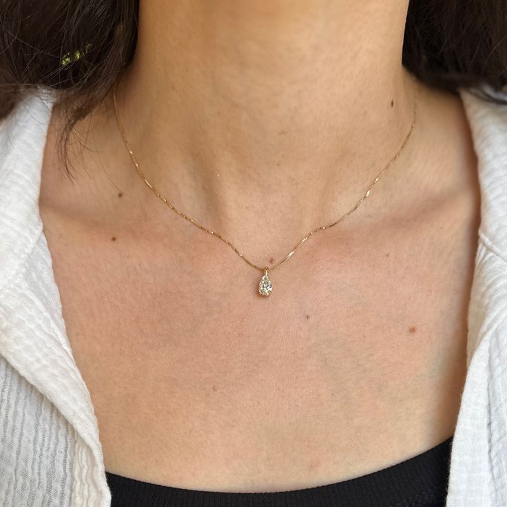 14KT Yellow Gold 4-Prong Basket Setting Pendant with Pear-Shape Lab-Created Diamond. A breathtaking yet minimal diamond pendant! Minimally set with the illusion the diamond is floating on the neckline! Made to order: 5-7 business days Pendant measures: 12.78mm x 5.23mm .78 Carat diamond Chain passage: 4.11 x 2.18mm Lab-created pear diamond E color VS1 clarity Grading report included 7.8mm x 5.09mm diamond approx. No chain included Stamped 14KT Gold Can also do in white gold, rose gold, different Minimalist Teardrop Pendant Necklace With Brilliant Cut, Minimalist Solitaire Necklace With Teardrop Diamond Cut Pendant, Minimalist White Gold Teardrop Pendant Diamond Necklace, Minimalist Teardrop Solitaire Necklace For Formal Occasions, Minimalist White Gold Teardrop Diamond Necklace, Minimalist Diamond Drop Necklace, Drop Necklace With Single Diamond For Anniversary, Dainty Teardrop Brilliant Cut Necklace, Anniversary Drop Necklace With Single Diamond