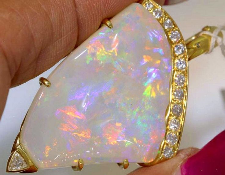 YELLOW GOLD OPAL AND GEMSTONES PENDANT NATURAL WHITE OPAL STONE AND 13 DIAMONDS BEAUTIFUL DESIGN OPAL WEIGHT - 30.85 CTS DIAMOND WEIGHT - 0.55 CTS 18 CT GOLD #Gemstone #the #of #Jewelry #Unveiling #Exploring #Treasures #Fashion #Allure #Beauty #the #JewelryLovers #Natures #Jewelry #of #Accessories Gemstones Pendant, Opal Stone, Opal Crystal, Opal Pendants, Dream Jewelry, White Opal, Opal Jewelry, Pretty Jewellery, Minimalist Jewelry