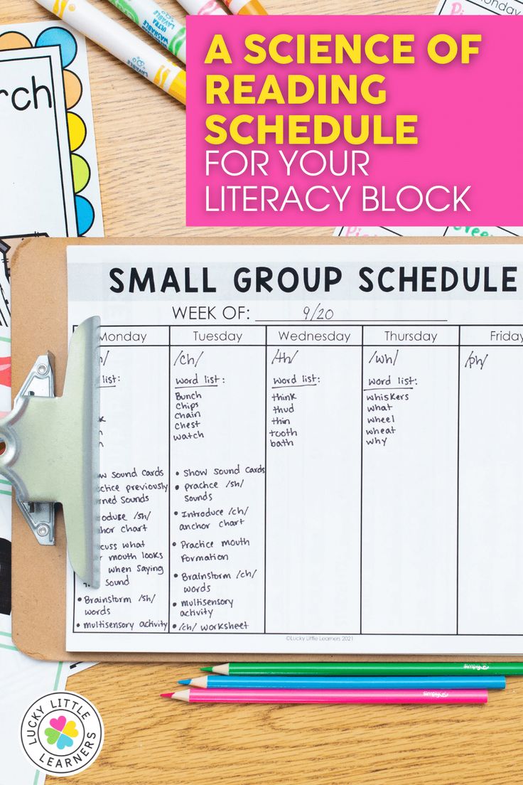 a small group schedule with pencils and crayons on the table next to it