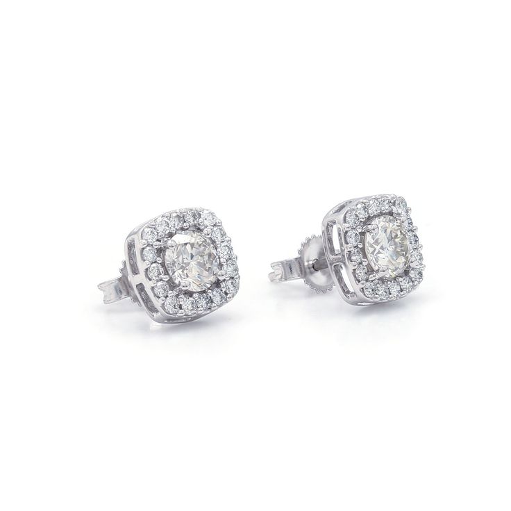 The Rosemary Earrings Make a wonderful impression with these beautiful halo stud earrings. Crafted in 14K white gold, each breathtaking earring features lustrous I-J, VS-SI center lab grown diamond for a 0.70 carat total weight combined, wrapped in a frame of shimmering petite lab-created diamonds with a total weight of 0.30 carats. Polished to a bright shine, these post earrings secure comfortably with friction backs. This Sku number is 456709 An IGL certificate can be requested, please allow t Classic Diamond Bridal Earrings With Halo Setting, Classic Diamond Cluster Earrings With Halo Design, Dazzling Diamond White Earrings With Halo Setting, Halo Design Cluster Earrings In Cubic Zirconia, Classic Cluster Earrings With Halo Setting And Round Cut, Diamond White Earrings With Round Cut Halo Design, Classic Bridal Earrings With Halo Setting Diamond, Diamond White Halo Design Earrings For Anniversary, White Lab-grown Diamond Earrings With Halo Setting