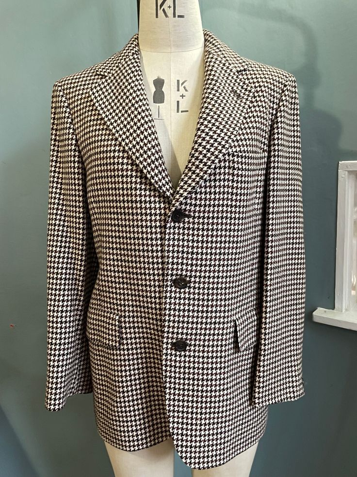 Beautiful Wool Jacket from AQUASCUTUM in a classic dogtooth checked wool in Dark Brown and white Horn buttons  Fully lined Great Condition Size 14 Tailored Houndstooth Outerwear With Lapel Collar, Winter Business Tweed Jacket With Houndstooth Pattern, Winter Business Houndstooth Tweed Jacket, Elegant Wool Houndstooth Outerwear, Classic Wool Houndstooth Tweed Jacket, Classic Wool Tweed Jacket With Houndstooth Pattern, Classic Tweed Houndstooth Outerwear, Classic Tweed Outerwear With Houndstooth Pattern, Classic Houndstooth Winter Outerwear