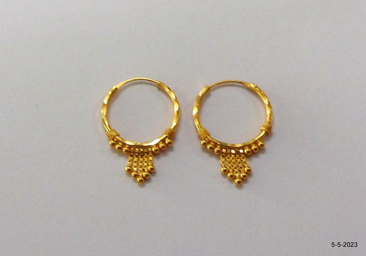 18kt gold hoop earring pair from rajasthan india. nice handmade design made of 18kt yellow gold, good for jewelry collection. Best gift item. Note - Please check pictures carefully for more details. Height - 2.4 cm Width - 1.6 cm Weight - 1.350 grams Material - 18kt yellow gold. Traditional Hoop Huggie Earrings Gift, Gold-plated Yellow Gold Hoop Earrings For Celebrations, 22k Gold Round Earrings For Puja, Yellow Gold-plated Hoop Earrings For Celebrations, Gold Plated Yellow Gold Hoop Earrings For Celebration, Yellow Gold Plated Hoop Earrings For Celebration, Hallmarked Round Earrings For Puja, Small Gold Hoop Earrings For Festivals, Traditional Gold Hoop Nose Rings