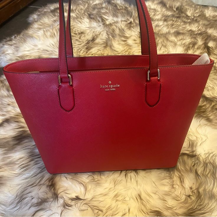 Red Leather Kate Spade Tote Bag, She’s Never Been Used, Still Has The Tag On, And Is In Pristine Condition. 15in Long, 10in Tall, 5in Wide. #Katespade #Katespadenewyork #Neverused #Totebag #Leather Large Capacity Red Tote Bag, Red Coated Canvas Tote Shoulder Bag, Kate Spade Red Shoulder Bag For Everyday, Kate Spade Red Bags For Daily Use, Kate Spade Red Tote Shoulder Bag, Kate Spade Tote Bag, Kate Spade Totes, Kate Spade Bags, Kate Spade Bag