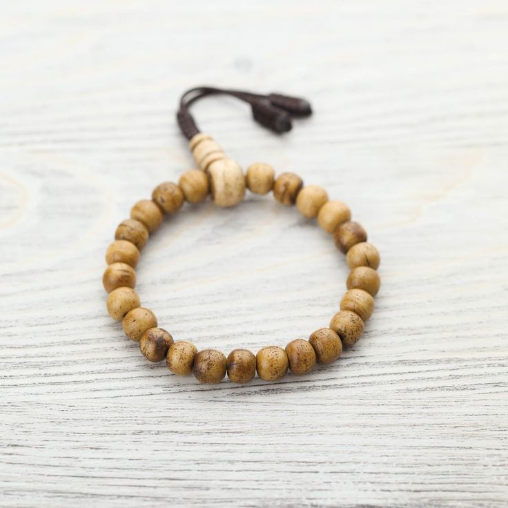 Made in Nepal, this traditional wrist mala bracelet features naturally stained water buffalo bone beads with a matching guru. They serve as a reminder to live in the present moment; because nothing is permanent, everything is possible. Because the beads are naturally stained, the color can begin to fade over time and with use. We consider this special process to be a visual representation of the growth in your practice and a further reminder of impermanence. Pair it with the matching Traditional Nothing Is Permanent, Buddhist Practices, Wrist Mala, Nothing Lasts Forever, Bone Jewelry, Water Buffalo, Live In The Present, Everything Is Possible, Mala Bracelet