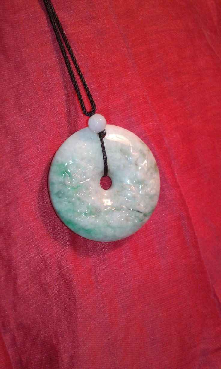 Untreated Jadeite Jade pendant, unisex this pendant is versatile. Pendant is heavy, pendant is thick, large chunk of untreated Jadeite Jade. Bi disc. Traditional in style. Great gift idea as most likely they won't have one of these! Jade Amulet Jewelry With Round Pendant, Spiritual Jade Jewelry With Large Pendant, Jade Round Pendant For Healing, Jade Healing Pendant Jewelry, Jade Round Large Pendant Jewelry, Unique Jade Necklace With Round Pendant, Jade Necklace With Round Pendant, Round Large Pendant Necklace For Good Luck, Good Luck Necklaces With Large Round Pendant