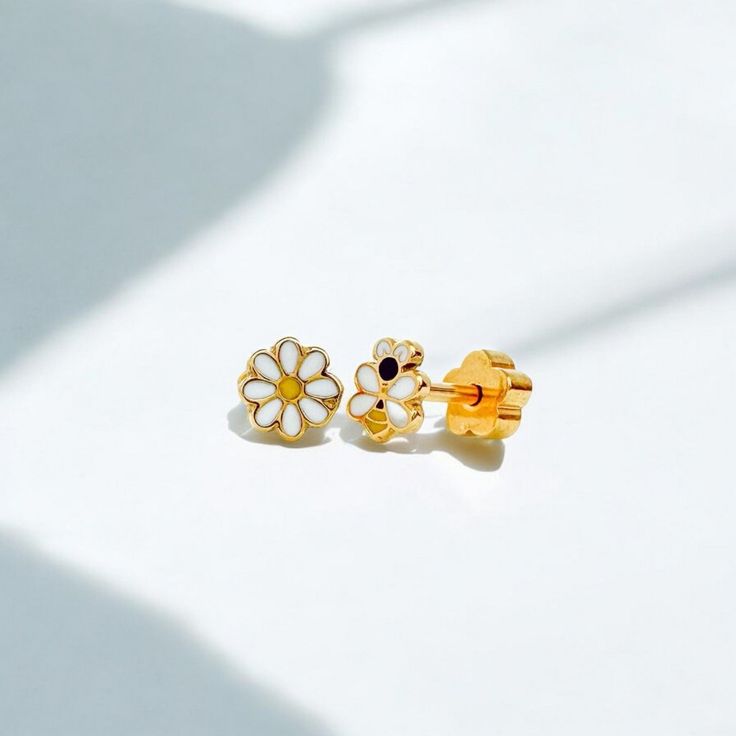 Bring a pop of style to your child's look with our Classic Gold Kids Earrings - featuring the cutest complimentary earrings: a BEE & DAISY! Made with hypoallergenic stainless steel posts, this sweet collection will keep their little ears happy and stylish. Perfect for any occasion, these earrings will add a playful touch to their outfit. Buzzing with charm! Perfect for kids of all ages! Cute Hypoallergenic Earrings, Cute White Huggie Jewelry, Cute Adjustable Earrings For Mother's Day, Cute Adjustable Huggie Earrings, Adjustable Hypoallergenic Earrings For Birthday, Cute Nickel-free Earrings For Mother's Day, Cute Nickel Free Earrings For Mother's Day, Cute Flower Shaped Hypoallergenic Earrings, Cute Hypoallergenic Flower-shaped Earrings