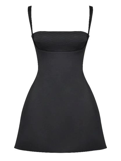 a women's black dress with straps on the front and back, it is made from