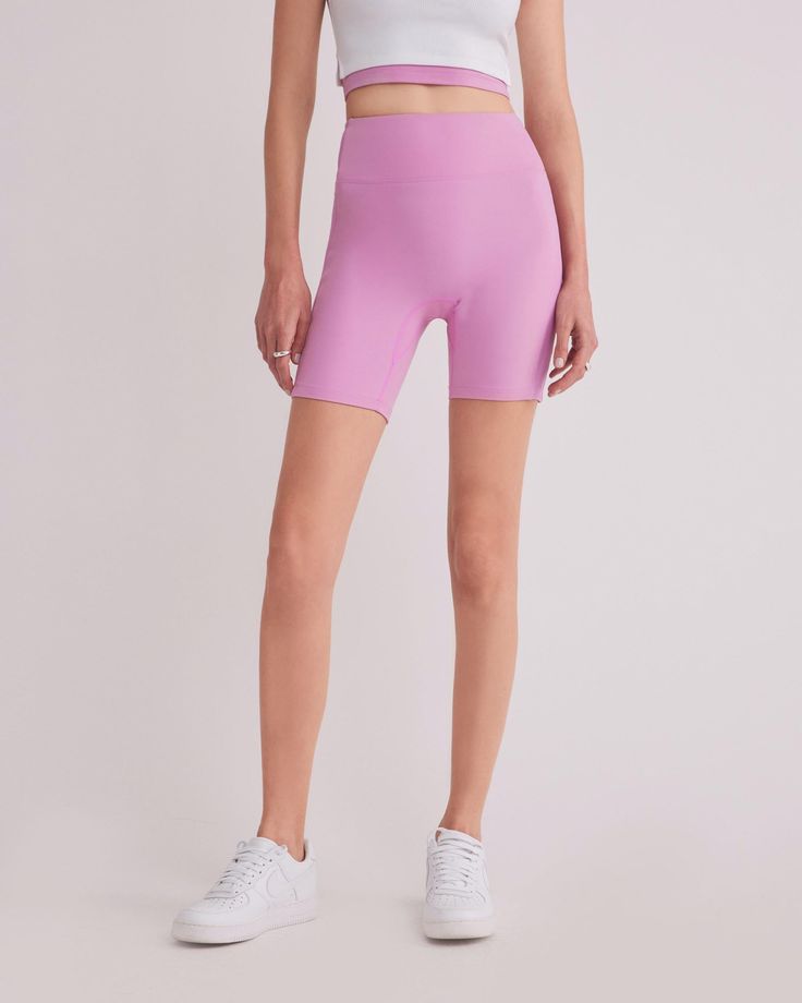 DETAILS: Color: Bubble gum pink High waist biker shorts with side contrast fabric Super soft & delicate brushed body fabric Medium weight 2x2 ribbed fabric on side panel Rubberized brand logo detail at back waist Body: 77% Nylon, 23% Spandex Contrast fabric: 93% Polyester, 7% Spandex Machine wash SIZE & FIT: Fits true to size Waist: 10 3/4" Inseam: 7" Model is wearing a size S High Waist High Stretch Biker Shorts, Spring Sports Compressive Shorts, Compressive Spring Activewear Shorts, Stretch Athletic Shorts With Ribbed Waistband, Sporty Biker Shorts With Ribbed Waistband, High Stretch Spring Activewear Shorts, Compressive High Waist Biker Shorts, Compressive High-waist Biker Shorts Sportswear, High Waist Compressive Biker Shorts