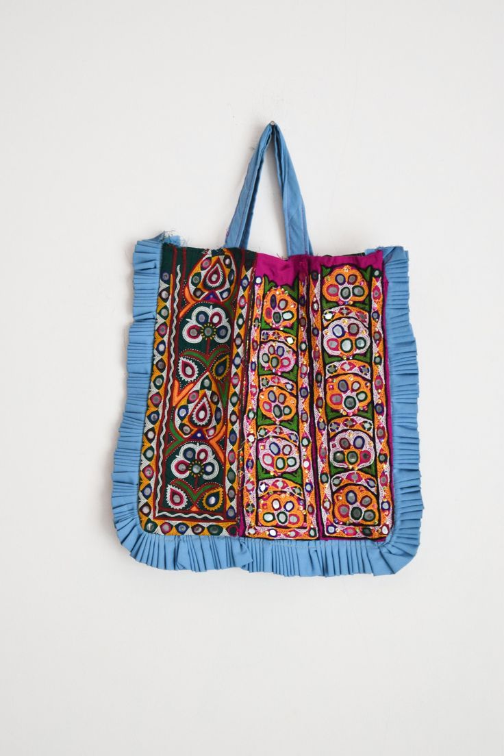 "Welcome to HarmonyHandicraftCo A very beautiful hand embroidered vintage Kutchi Banjara Bag. It has Both side fully Embroidery. This bag is from the Banjara tribal people with mirror embroidery and decorated with tassely pompom all round which makes it very attractive. Vintage Handmade Kutchi Bag, Hand embroidery Banjara boho handbag, Kutch bag, Kutchi Work Tote Bag, Shoulder Bag, Ibiza boho bag, Dowri bag, Banjara Boho Bag, Women shoulder bag, Kutch Embroidery Bag, Indian style bag, Indian boh Kutchi Work, Kutch Embroidery, Boho Handbag, Mirror Embroidery, Kutch Work, Boho Handbags, Work Tote Bag, Embroidery Bags, Eco Friendly Bags