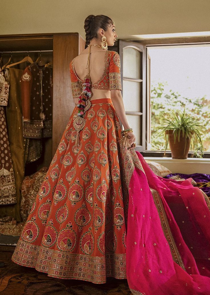 Elegant Orange Embroidered Lehenga Choli Pakistani Bridal Ensemble Intricate Embroidery Raw Silk Lehenga, Embroidered Lehenga For Reception Navratri, Embroidered Lehenga For Reception And Navratri, Embroidered Lehenga For Reception During Navratri, Diwali Chanderi Lehenga With Intricate Embroidery, Floor-length Embroidered Choli For Reception, Floor-length Sharara With Embroidery In Raw Silk, Navratri Anarkali Dress With Intricate Embroidery, Floor-length Embroidered Sharara In Raw Silk