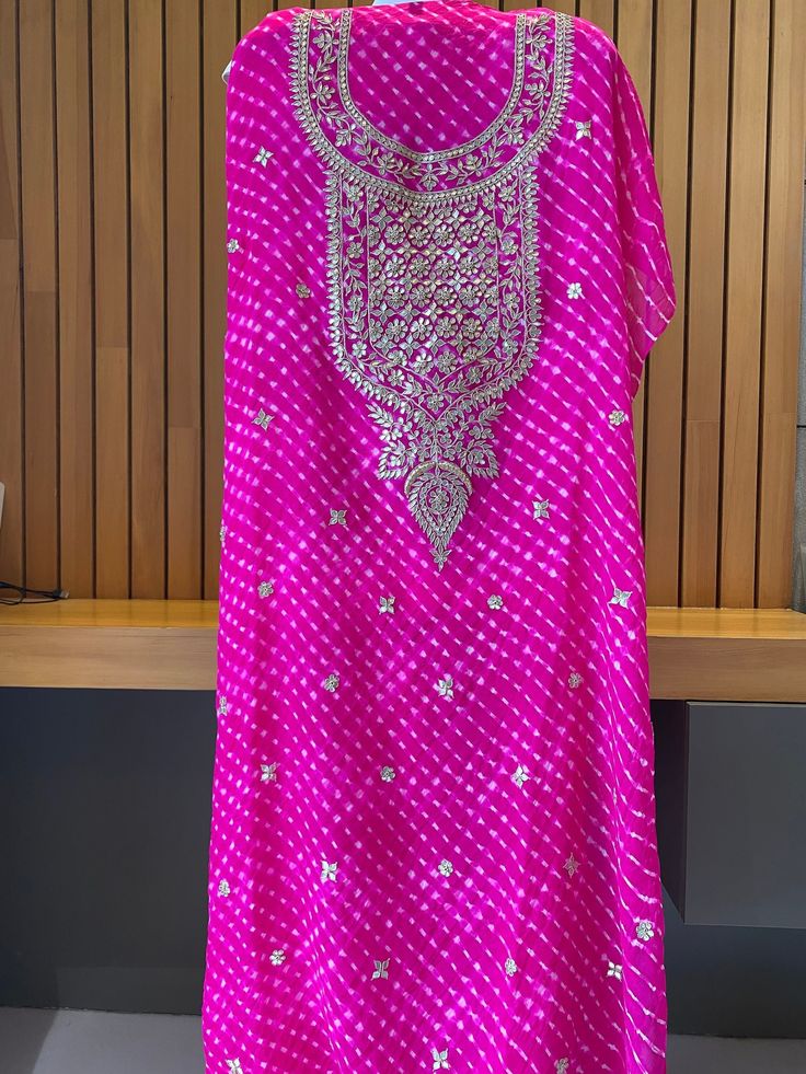 A beautifully handwoven pure georgtte silk mothara kurta fabric with heavy gota patti work making it perfect for festival and traditional occasions. Pure Georgette fabric is made from the finest silk and woolen threads. The fabric is delicate but strong and has a unique lustrous sheen. It is often used for wedding dresses and special occasions. An additional dyeing using the leheria technique produces Mothara. In the making of mothara, the original resists are removed and the fabric is re-rolled Georgette Fabric, Checkered Pattern, Pink Fabric, Bridal Outfits, Traditional Outfits, Wedding Outfit, Lehenga, Womens Clothing Tops, Hand Weaving