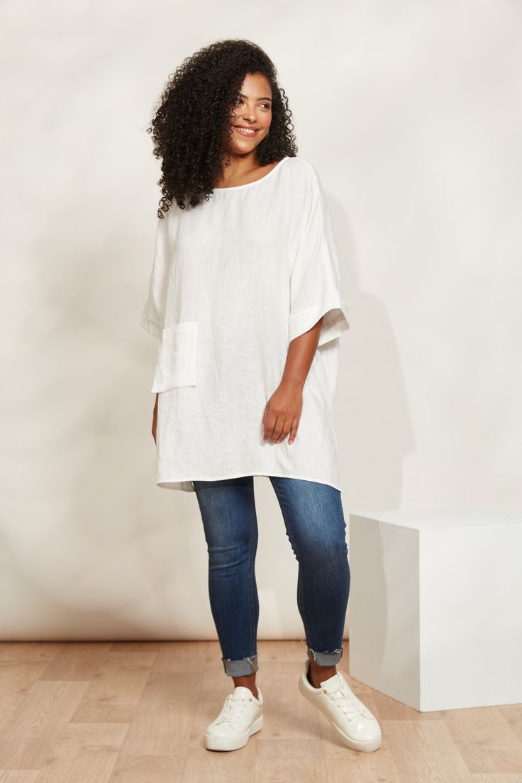 STYLE DETAILS: Enjoy carefree summer days in style with the Halcyon Relaxed Top, crafted from 100% linen. Its relaxed fit and contemporary tunic design, featuring high-side vents, ensure you stay cool and comfortable all season long. Pair it with matching linen shorts or loose pants for an effortless look perfect for soaking up the sun and embracing those relaxed summer vibes. FEATURES: Round neck Elbow-length sleeves Patch pocket High side vents Relaxed fit 100% Linen One Size Chic Linen Tunic For Vacation, Casual Linen Dress For Vacation, Casual Ramie Linen Dress For Vacation, Summer Cotton Tunic With Relaxed Fit, Chic Relaxed Fit Linen Dress For Day Out, Summer Cotton Tunic With Pockets, Spring Relaxed Fit Tunic With Pockets, Beach Ramie Tops With Relaxed Fit, Oversized Linen Summer Tops