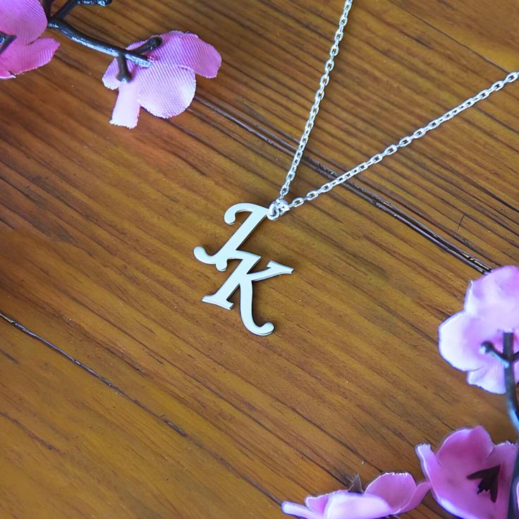 Express your style and personality in the most elegant way with our personalized initial necklaces. Carry their initials close to your heart with this beautifully crafted piece. Made from high quality materials, this necklace is perfect for both daily use and special occasions. This special gift will be a unique gift for your mother, wife, or sister.  Make her happy on special occasions like Birthday, Aniversary, Mother's Day, or Christmas! You can easily contact us with your questions. We will Initial Pendant Charm Necklace For Anniversary, Initial Pendant Charm Necklaces For Anniversary, Classic Initial Pendant Necklace For Anniversary, Anniversary Gift Initial Pendant Charm Necklaces, Anniversary Gift Initial Pendant Charm Necklace, Silver Initial Necklace With Chain As Gift, Silver Initial Necklace For Valentine's Anniversary, Sterling Silver Initials Name Necklace For Birthday, Silver Initial Necklace For Anniversary On Valentine's Day