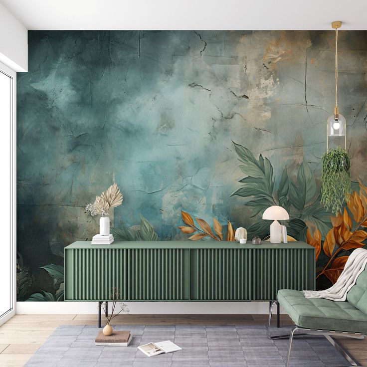 a living room with green furniture and wall mural