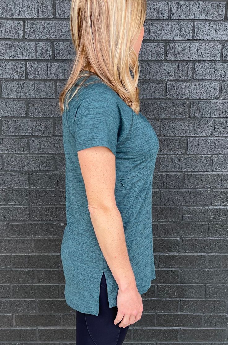 Finally a loose-fitting, short sleeve workout top with a nursing opening that's hidden! Moisture-wicking, V-neck, long length, and super flattering! This 2.0 version has a new softer fabric! NURSING ACCESS: this t-shirt has a horizontal nursing zipper - one long zipper with zipper pulls on both sides. FIT: Fits true to size FABRIC: 92% polyester, 8% spandex MODELS:Quinn is 5'1, a size XS (2), 34C and is wearing a size XS.Denita is 5'5, a size M/L (10/12) and 34 DDD/F and sized down to a medium.J Fit Nurse, Workout Tshirts, Zipper Pulls, Maternity Wear, Baby Size, Deep Sea, Long Length, Workout Tops, Moisture Wicking