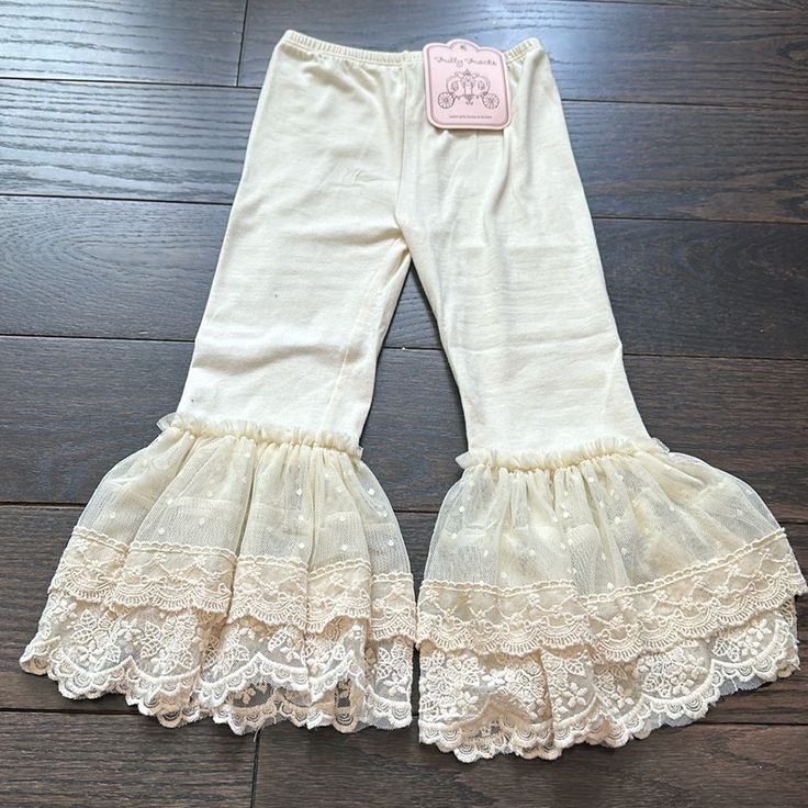 Ivory Legging With Lace And Tulle Bell Bottoms By Frilly Frocks (A Division Of Haute Baby). Fitted Cream Bottoms With Lace Trim, Cute Cream Cotton Bottoms, Fitted Cream Bottoms With Ruffles, Ivory Leggings, Crochet Halter Tops, Leggings Kids, Girls Leggings, Grey Leggings, Bell Bottom