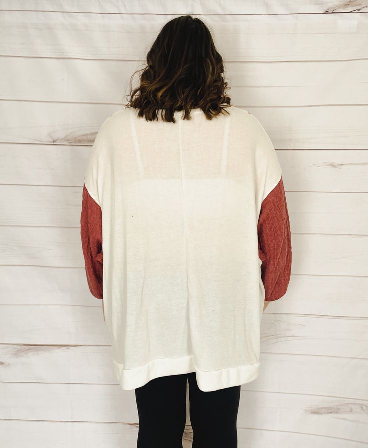 Let's celebrate the start of summer with a top that's just plain gorgeous. A cross between a top, a crewneck pullover, and a sweater, this top is made of the SOFTEST fabric ever and has a fun color-block look with the cable-knit sleeves. You're going to want to wear this every day. The fabric is incredibly lightweight (and oversized) making this the perfect top for summer evenings, whether you're heading out to dinner, to a brewery, or for a post-sunset beach stroll. Plus, this top will be styli Trendy Color Block Sweater For Loungewear, Oversized Color Block Sweatshirt For Layering, Cozy Oversized Knit Top For Layering, Oversized Cozy Knit Top For Layering, Oversized Color Block Sweatshirt For Fall, Spring Crew Neck Long Sleeve Top With Textured Knit, Spring Textured Knit Long Sleeve Crew Neck Top, Spring Knit Sweatshirt For Layering, Cozy Relaxed Fit Knit Top For Layering