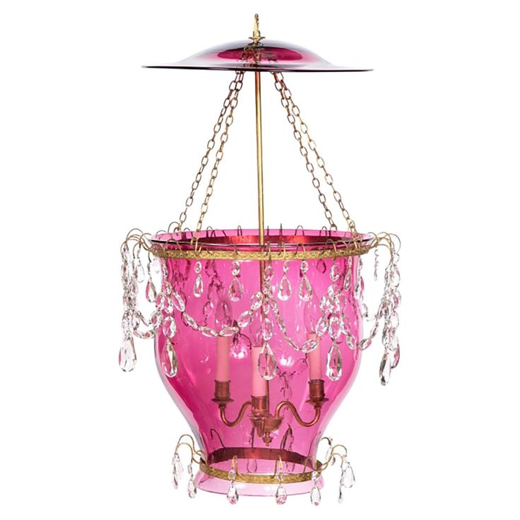 a pink chandelier hanging from a ceiling