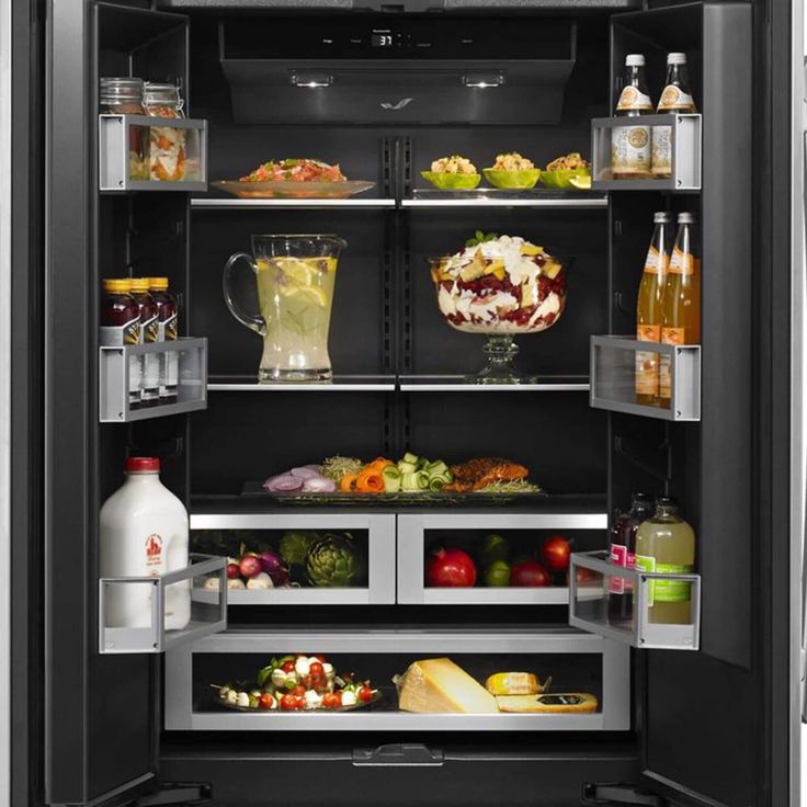 an open refrigerator filled with lots of food