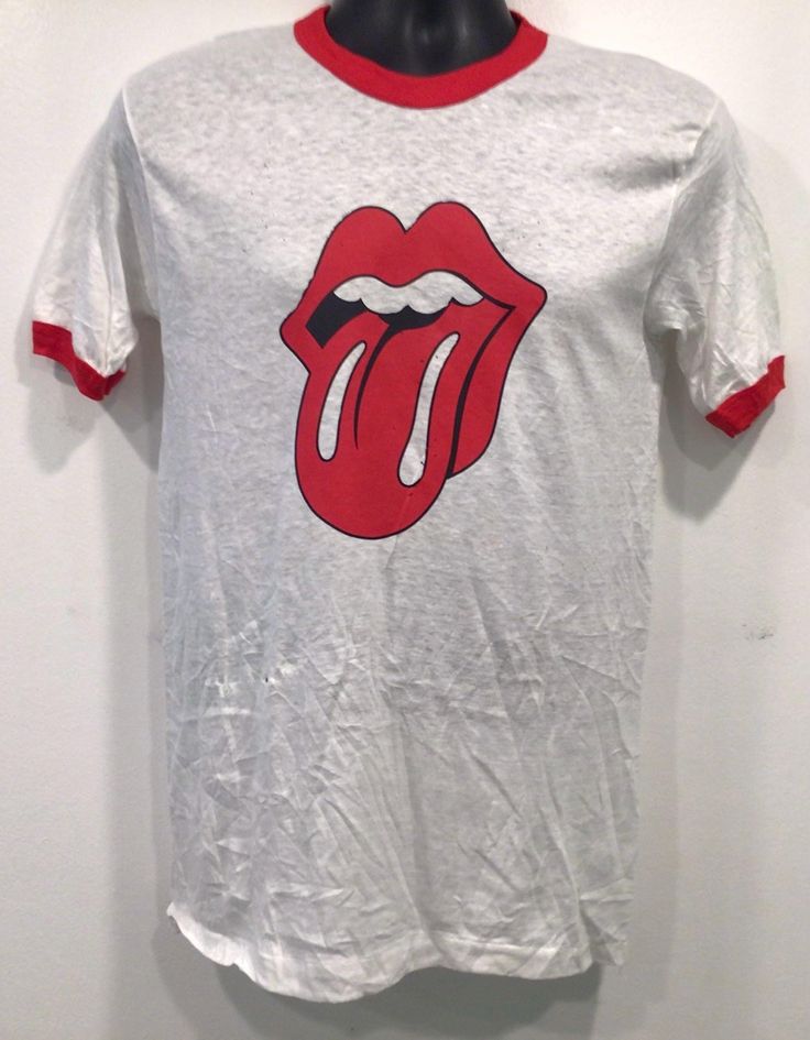 Vintage original 1970s Rolling Stones lips dc tee, size M...j371 MEASUREMENTS: (All measurements were taken lying flat. Shoulders -16"(measured on back of the shirt from seam to seam) pit to pit "16.5=33" Slee-8"measured from shoulder to cuff Sleeve -5"(measured from pit to cuff) Length -27"(measured on top of shirt collar to the bottom hem)   item is has one hole and sum small marks on the front. Please ask all questions before purchasing as all sales ar final, except if mis represented. Shirt Collar, Cuff Sleeves, Rolling Stones, Festival Season, 20 Cm, Favorite Outfit, 1970s, Gender Neutral, Bathing Beauties