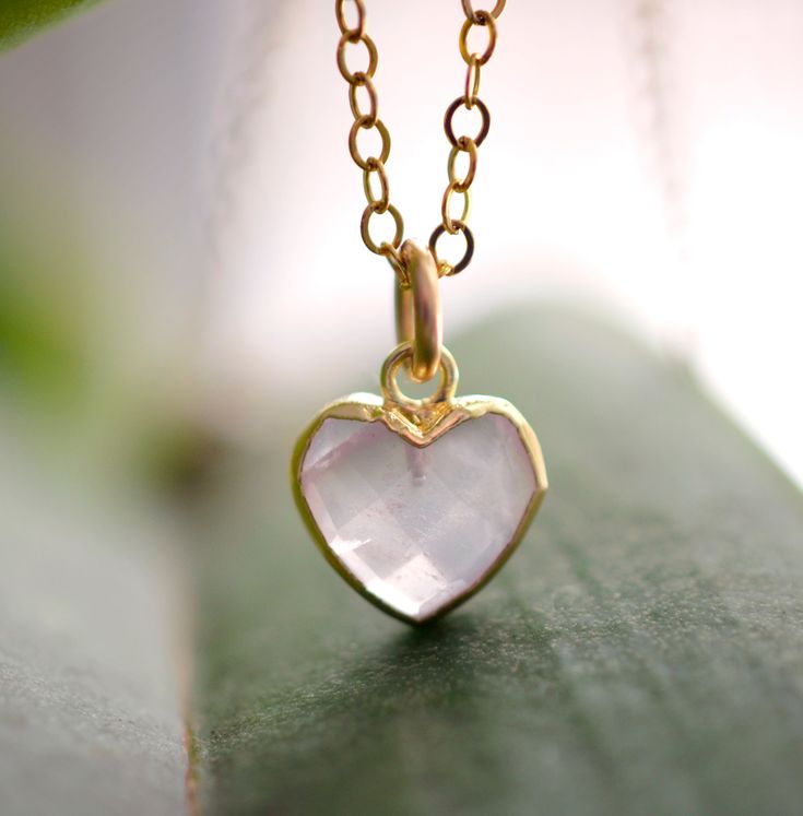 Looking for a unique accessory for some self love, or love for that special someone? Crafted from 14k gold filled and natural Rose Quartz, this pendant is the perfect, sparkling way to show anyone how much you care. Rose Quartz is a stone of love. It is believed to restore trust & harmony in relationships and encourage unconditional love. It purifies the heart and promotes self love, inner healing, and friendship. It is an alternate birthstone for January, as well as the spiritual birthstone for 14k Gold Heart Necklace With Gemstone For Gift, Handmade Rose Gold Heart Pendant Jewelry, Dainty Rose Quartz Pendant Jewelry, Rose Gold Jewelry With Rose Quartz For Gift, Rose Gold Rose Quartz Jewelry Gift, Minimalist Gemstone Jewelry For Valentine's Day, Rose Gold Rose Quartz Jewelry Perfect For Gifts, Feminine Rose Gold Jewelry With Heart Charm, Rose Gold Heart Charm Jewelry As Gift