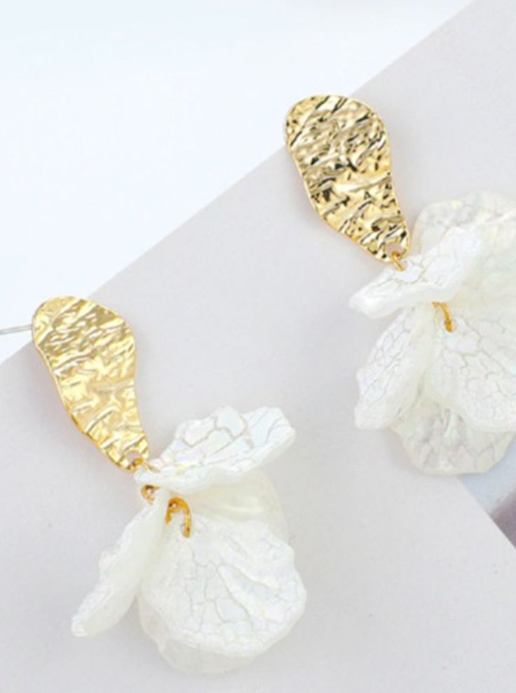 White Metal Flower Shaped Jewelry, White Metal Flower-shaped Jewelry, White Metal Jewelry For Spring, Handmade White Leaf-shaped Jewelry, Elegant White Hammered Jewelry, Elegant White Leaf-shaped Earrings, Cream Earrings For Spring Gift, White Leaf-shaped Jewelry Gift, Cream Earrings Perfect For Spring Gift