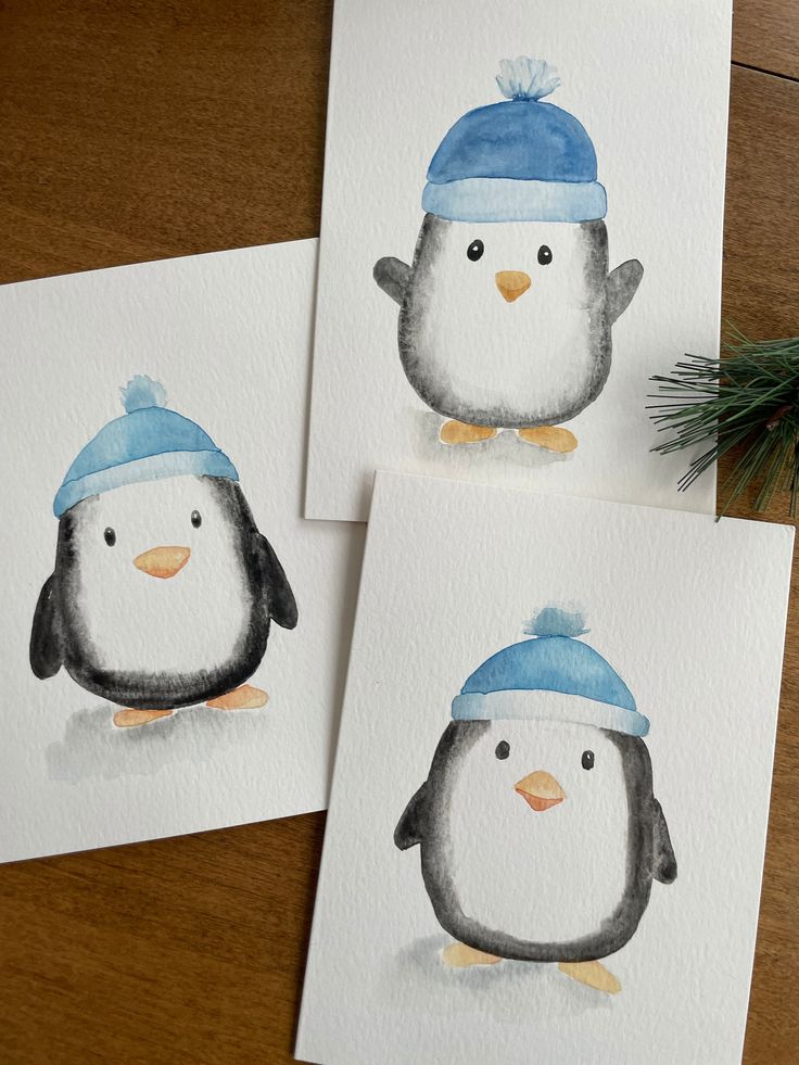 three watercolor paintings of two penguins wearing hats and one is holding a pine branch