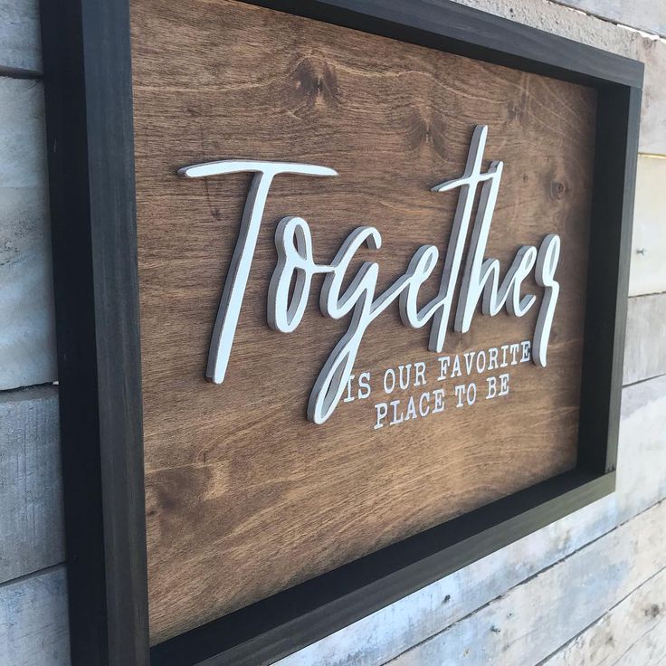 a wooden sign that says together as our favorite place to be