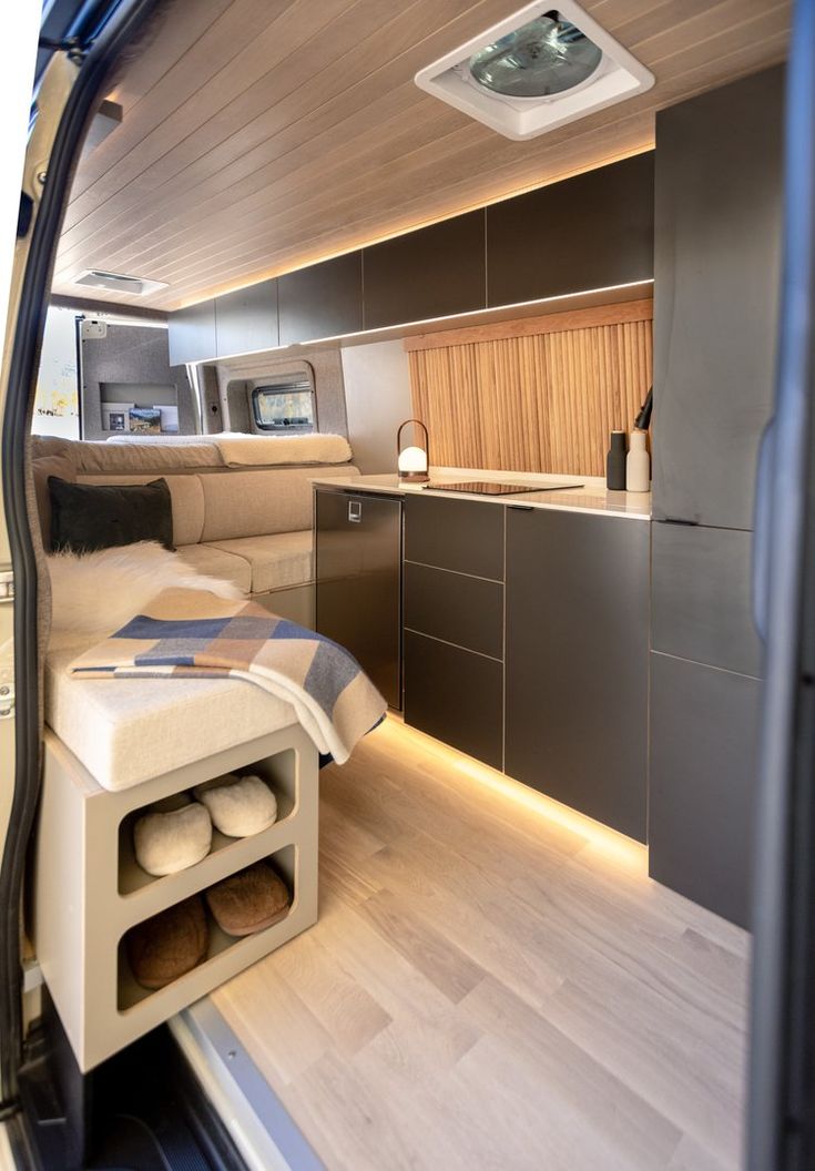 the interior of a boat that has been converted into a kitchen and living room area