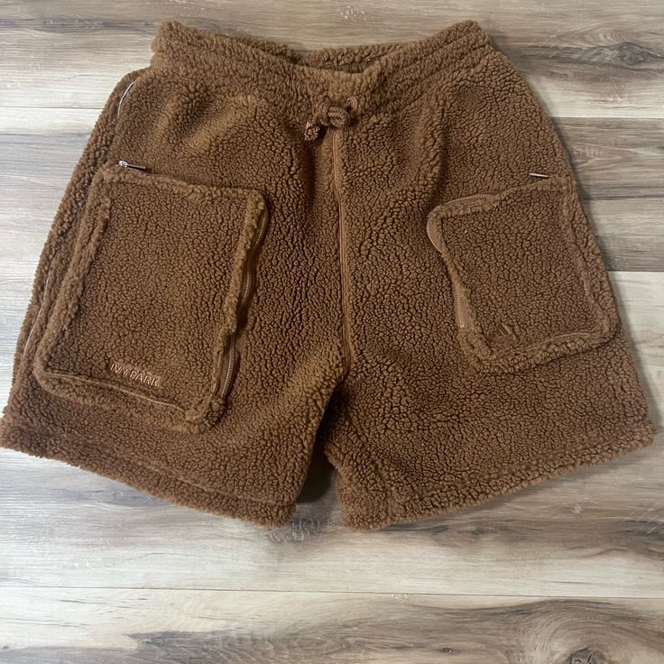 Brown Sherpa Size Small Never Worn Sporty Brown Bottoms With Built-in Shorts, Brown Pocketed Shorts For Streetwear, Brown Shorts With Pockets For Streetwear, Brown Streetwear Shorts With Pockets, Brown Shorts With Pockets For Fall, Brown Cotton Shorts For Streetwear, Winter Bottoms With Pockets In Short Length, Trendy Brown Shorts With Short Legs, Casual Brown Shorts With Side Pockets