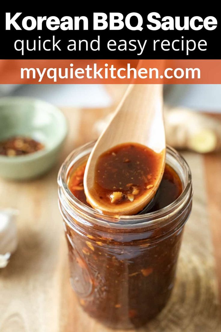 korean bbq sauce in a glass jar with a wooden spoon full of barbecue sauce