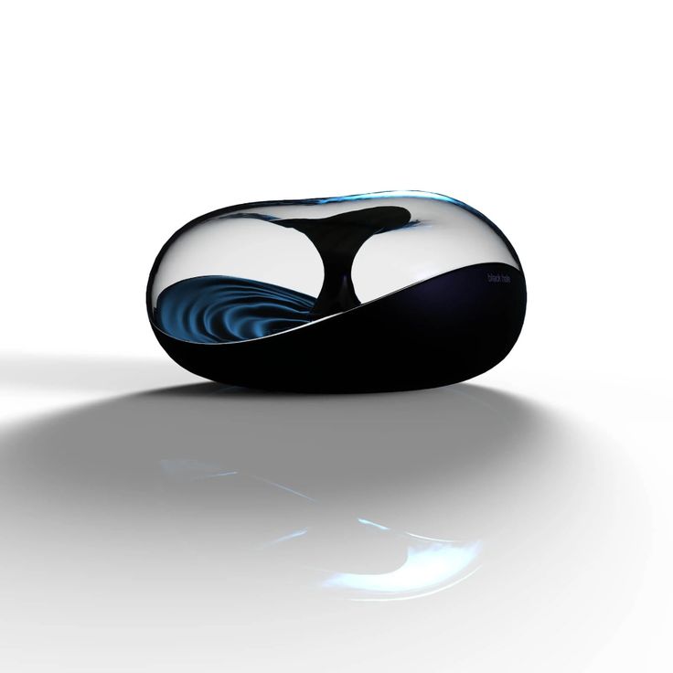 a black and white object with blue swirls on it's surface, against a white background