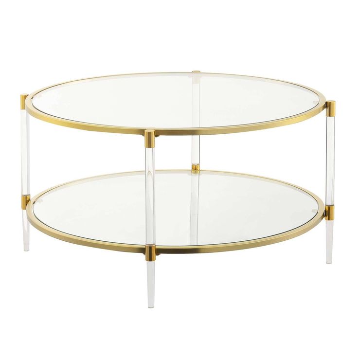 an oval glass and brass coffee table with two tiered shelves on each side,