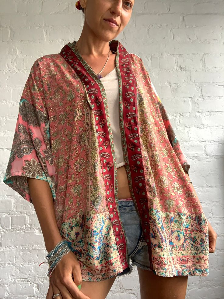 This is colourfull hippie gypsie boho free size shirt made oversized to fit all perfect summer cover up, at the beach, party or everyday unique design, one and only plus size more available at https://www.etsy.com/shop/AltheaStores?ref=seller-platform-mcnav Thank you for looking Summer Festival Patchwork Kimono, Patchwork Kimono For Summer Festivals, Bohemian Patchwork Kaftan With Kimono Sleeves, Bohemian Kaftan With Patchwork And Kimono Sleeves, Bohemian Patchwork Kimono For Beach, Bohemian Beach Kimono With Patchwork, Bohemian Patchwork Beach Kimono, Oversized Silk Bohemian Kimono, Spring Festival Kimono With Patchwork