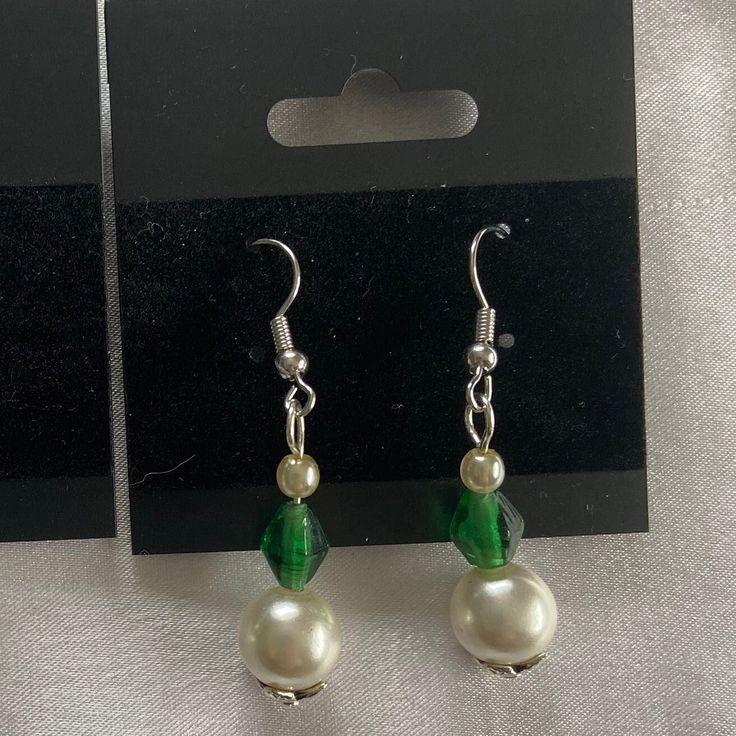 This unique pair of earrings is the perfect gift for any occasion. The vibrant green colors combined with the leaf-shaped bead cap give this pair a nature-y feel that you are sure to love. There is only one in stock, so buy soon! All findings are nickel-free, beads were thrifted, and materials were purchased at respectable stores. Pearl beads are faux. Thank you for shopping with us! If you like what we make, follow us over on Instagram @halcyon_delights Green Beaded Teardrop Jewelry, Green Dangle Flower Earrings For Party, Nickel-free Green Earrings For Party, Green Teardrop Beaded Earrings For Party, Green Nickel-free Party Earrings, Nickel-free Green Beaded Earrings For Parties, Green Beaded Crystal Earrings, Adjustable Green Teardrop Jewelry, Adjustable Teardrop Green Jewelry