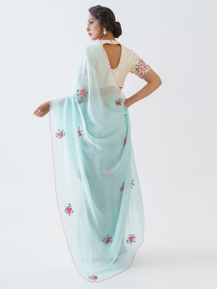 This is a three-piece light blue floral saree set from the Suruchi Parakh collection. The light blue floral saree is paired with an embroidered off-white blouse. The blouse has padding and a back hook opening with a cut-out detail. There are beautiful floral motifs of zardozi, pearl and thread work all over the blouse and saree. This saree set is crafted in soft organza and tussar silk fabrics. The outfit is completed with an inner skirt for the saree.
Clutch NOT included. Summer Reception Saree With Dupatta, Traditional Blue Pre-draped Saree With Floral Embroidery, Semi-stitched Cotton Silk Pre-draped Saree With Floral Embroidery, Blue Cotton Silk Blouse Piece With Sheer Dupatta, Summer Saree With Zari Work For Reception, Summer Reception Saree With Zari Work, Spring Cotton Silk Saree, Blue Pre-draped Saree With Chikankari Embroidery, Spring Traditional Saree With Sheer Dupatta