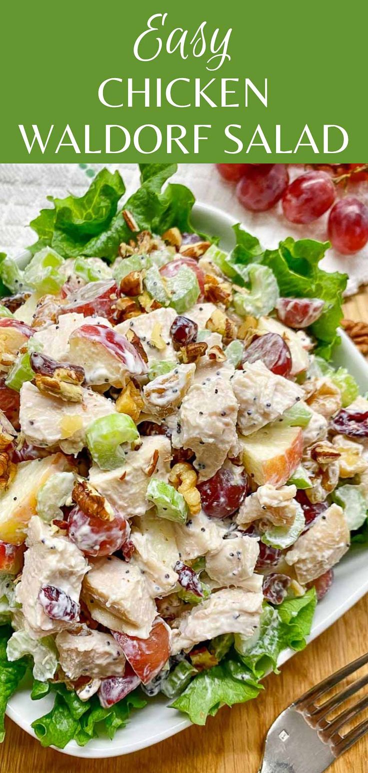 chicken salad with grapes and lettuce on a white plate