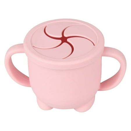 a pink cup with a red design on it